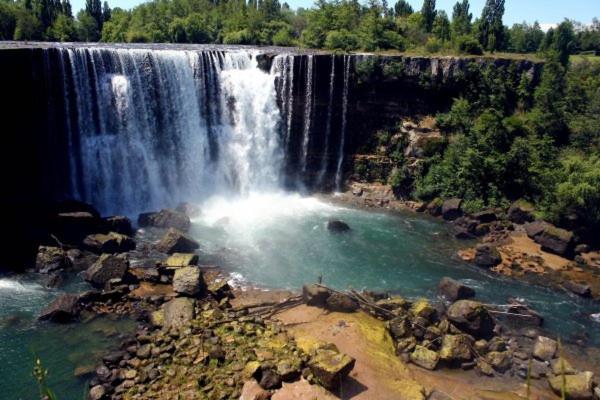 an aerial view of a waterfall in a river at Cabaña el ricky in Cabrero