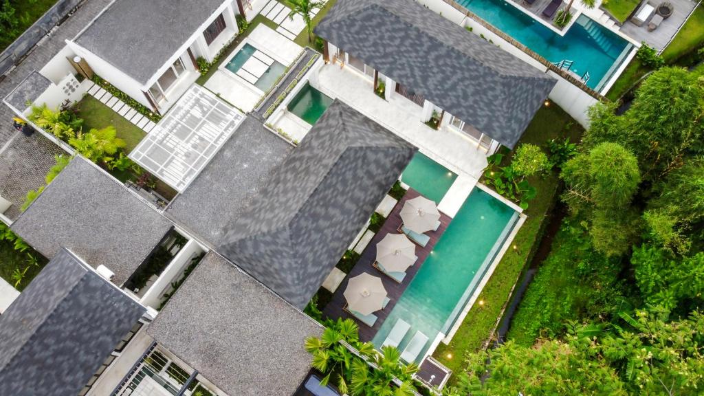 an overhead view of a house with a swimming pool at Villa Markandeya by BaliSuperHost in Ubud