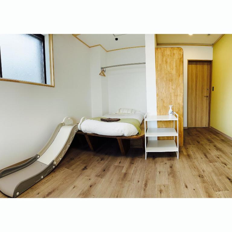 Postel nebo postele na pokoji v ubytování CABIN Nozawaonsen