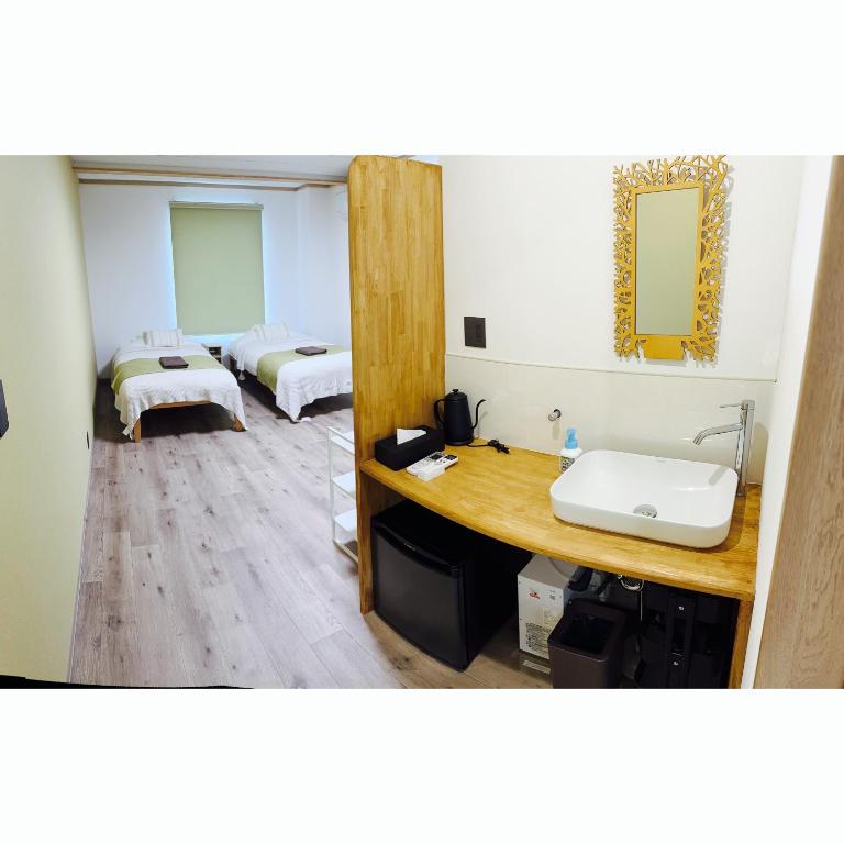 Postel nebo postele na pokoji v ubytování CABIN Nozawaonsen