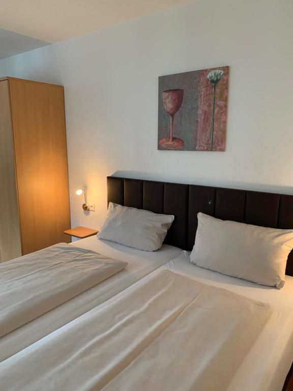 Postel nebo postele na pokoji v ubytování Fleiner Gästehaus