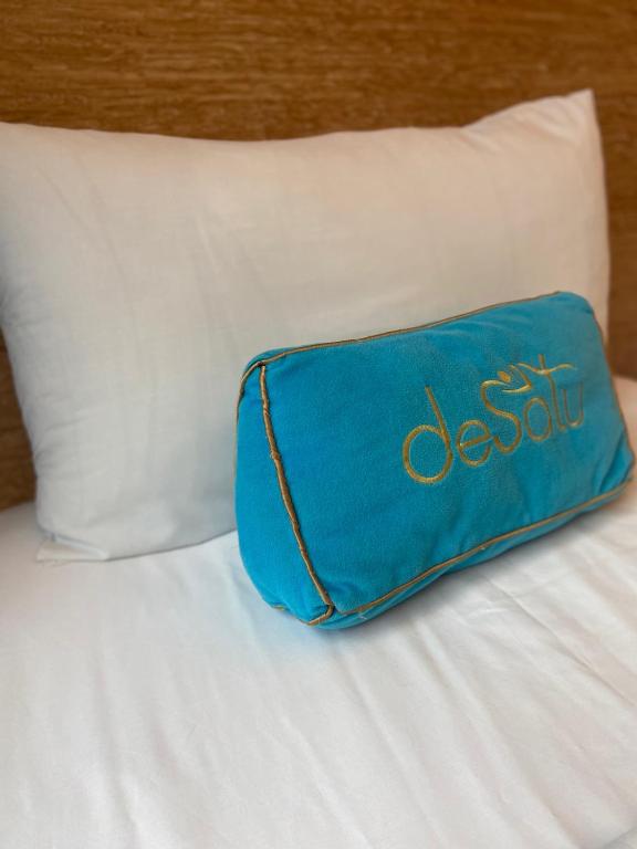 Postel nebo postele na pokoji v ubytování Desatu Hotel