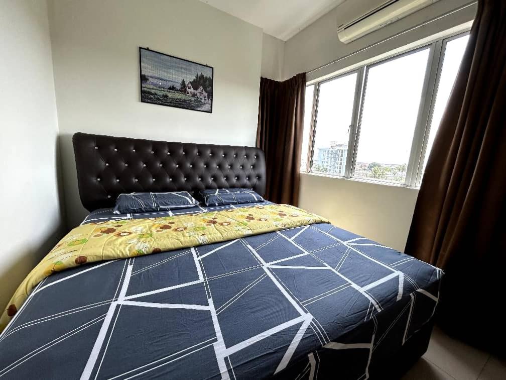 Кровать или кровати в номере Sekinchan SeaBreeze Homestay 适耕庄海风吹民宿