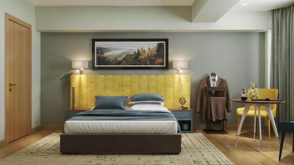 Postel nebo postele na pokoji v ubytování CH Hotel