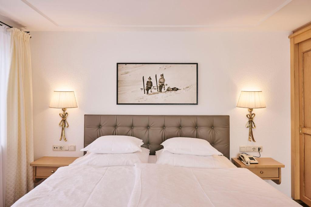 Posteľ alebo postele v izbe v ubytovaní Hotel Garni Sursilva