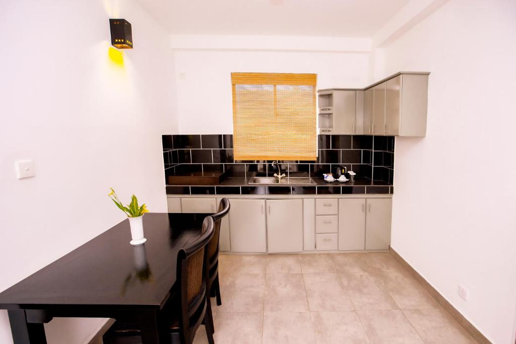 Kuchyň nebo kuchyňský kout v ubytování St.Lachlan Hotel & Suites