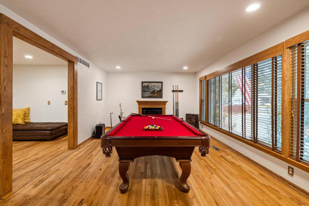 a living room with a pool table in it at Marshall Street Music Retreat in Boise