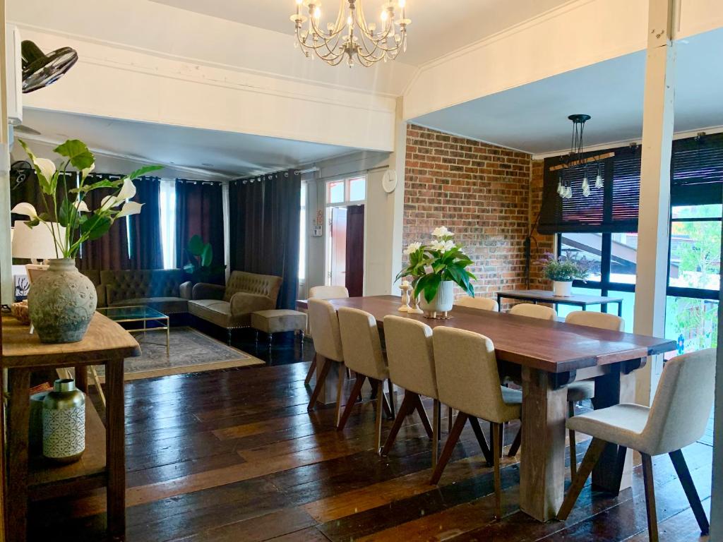 a dining room with a table and chairs at VillaKampung in Kuala Terengganu