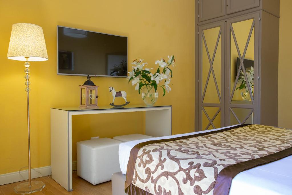 Postel nebo postele na pokoji v ubytování Boutique Hotel del Corso