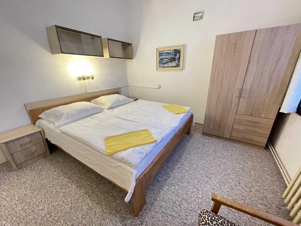 Postel nebo postele na pokoji v ubytování Hotel Zlatá vyhlídka