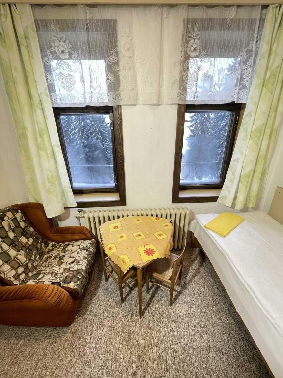 Postel nebo postele na pokoji v ubytování Hotel Zlatá vyhlídka
