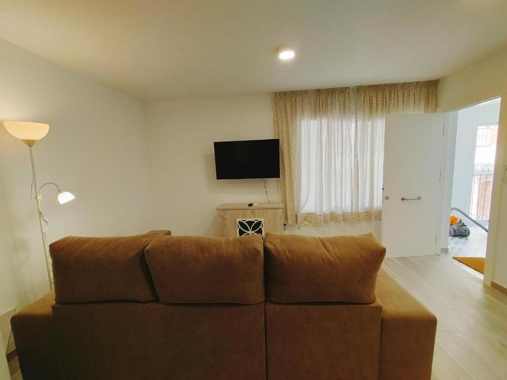 TV a/nebo společenská místnost v ubytování Nerja Sun Apartment Bronce A Centro