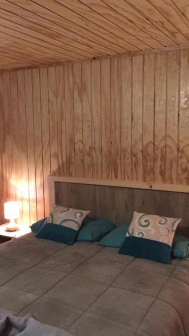 Uma cama ou camas num quarto em Surf and Stay Chile