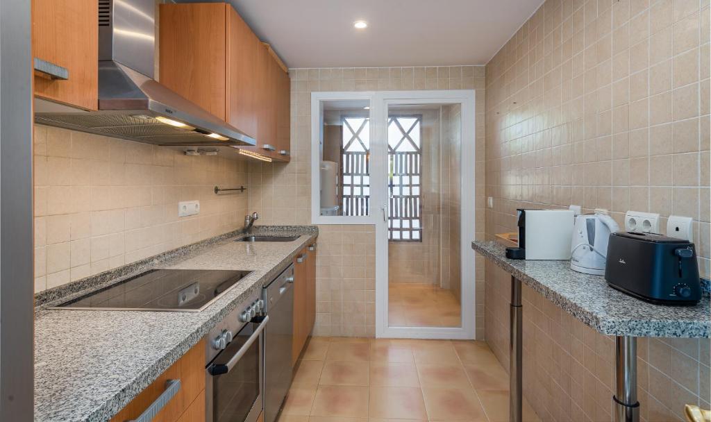A kitchen or kitchenette at Los Eucaliptos Appartement deux chambres Chez Stefan