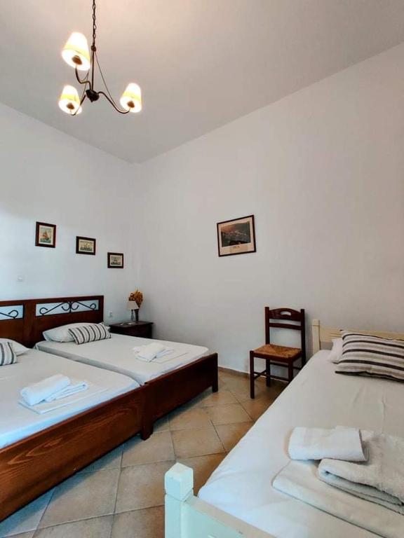 Postel nebo postele na pokoji v ubytování Akti Rooms And Studios