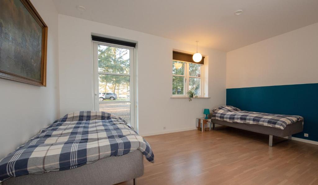 Postel nebo postele na pokoji v ubytování Guesthouse Tradsborgvej