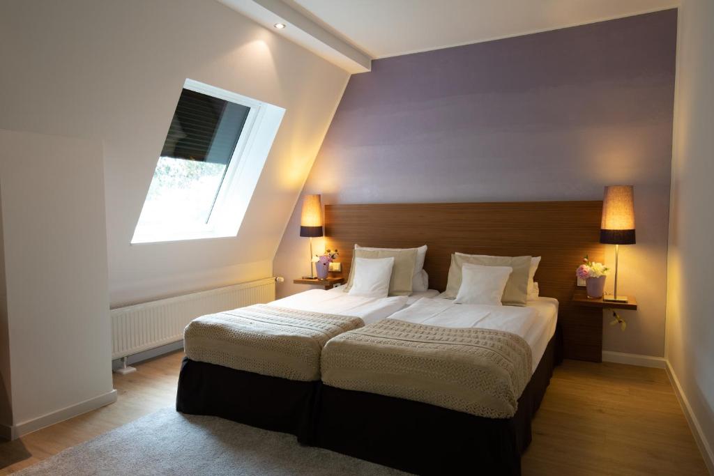 Postel nebo postele na pokoji v ubytování Hotel Vulcano Lindenhof