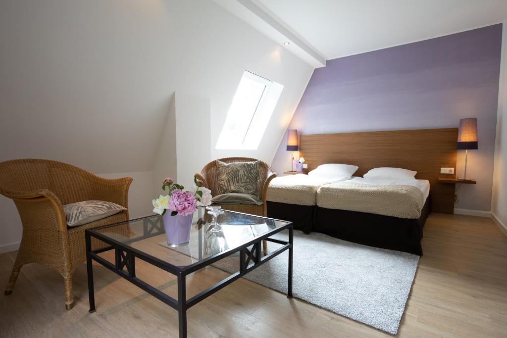 Postel nebo postele na pokoji v ubytování Hotel Vulcano Lindenhof