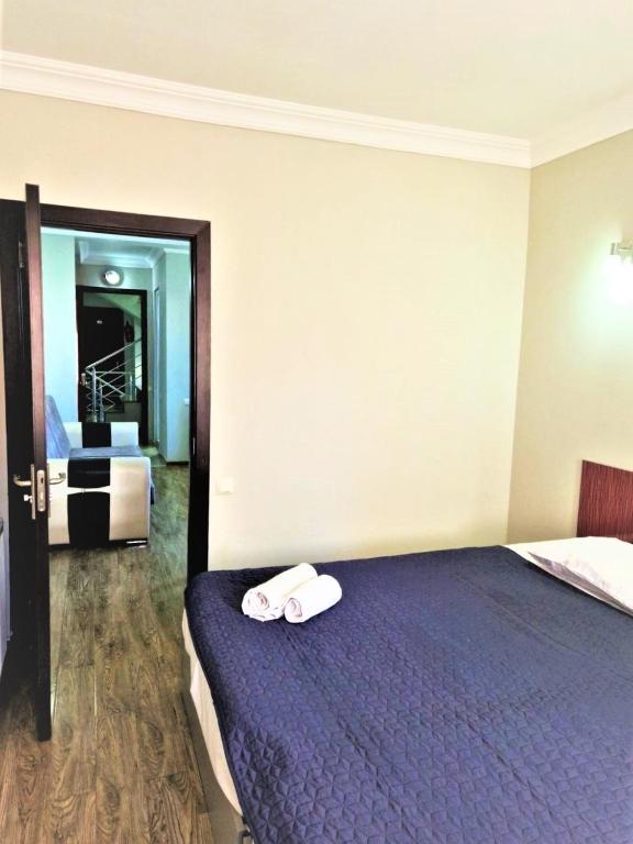 Postel nebo postele na pokoji v ubytování Panorama Hotel Batumi