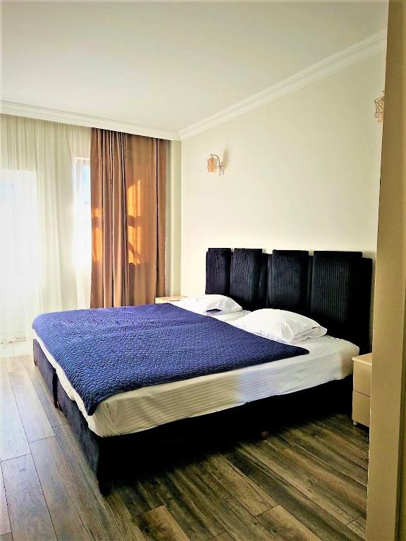 Postel nebo postele na pokoji v ubytování Panorama Hotel Batumi