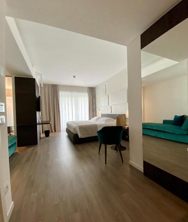 Postel nebo postele na pokoji v ubytování Solho Hotel
