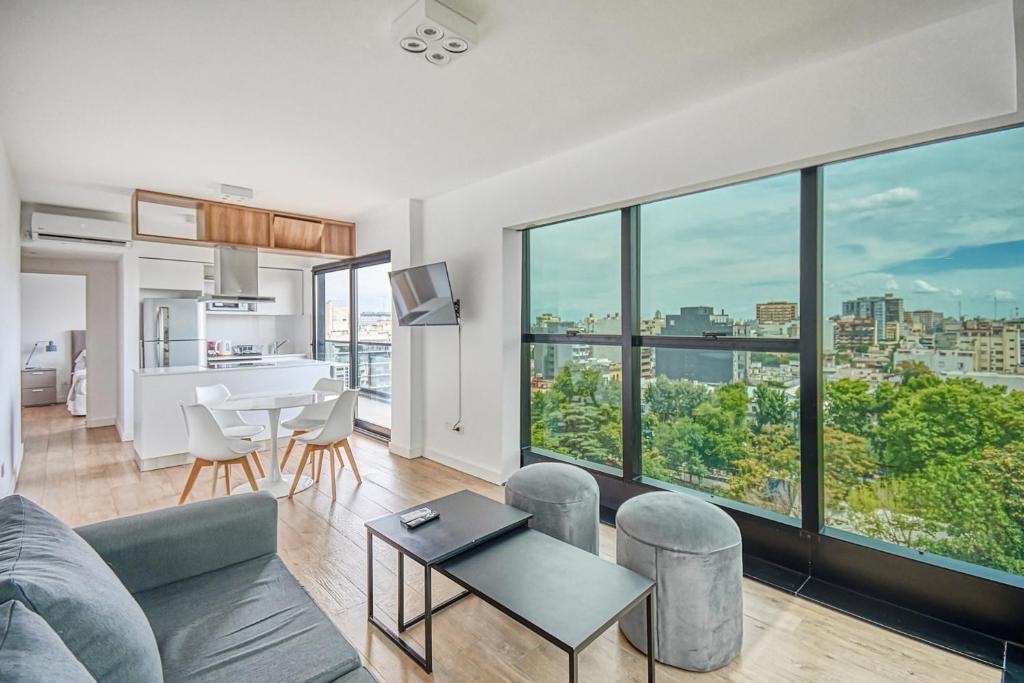 a living room with a couch and a table at Live Soho Boutique & Apartments Belgrano in Buenos Aires