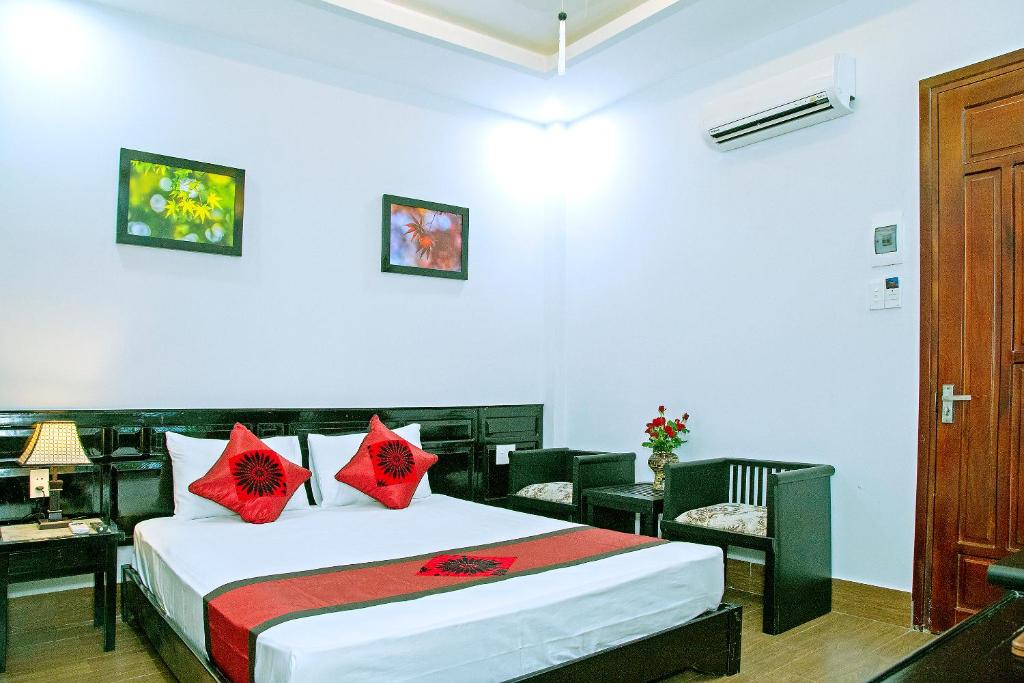 Giường trong phòng chung tại Green Sand Homestay