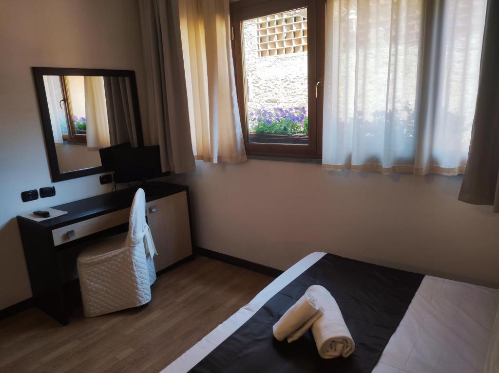 Postel nebo postele na pokoji v ubytování Hotel Carignano