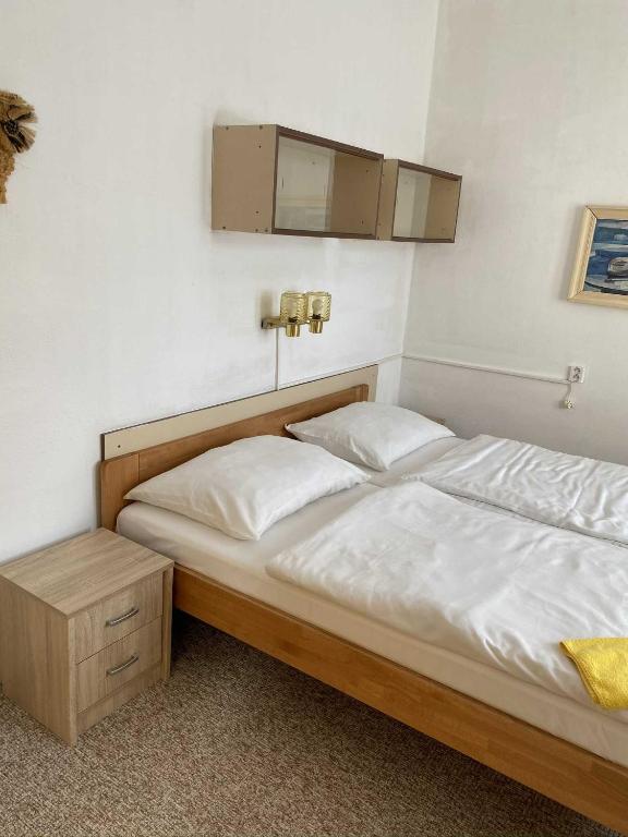 Postel nebo postele na pokoji v ubytování Hotel Zlatá vyhlídka