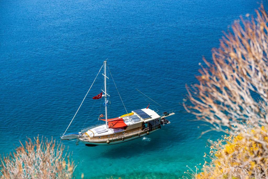 a boat floating on a body of water at Blue Cruise in Kaş