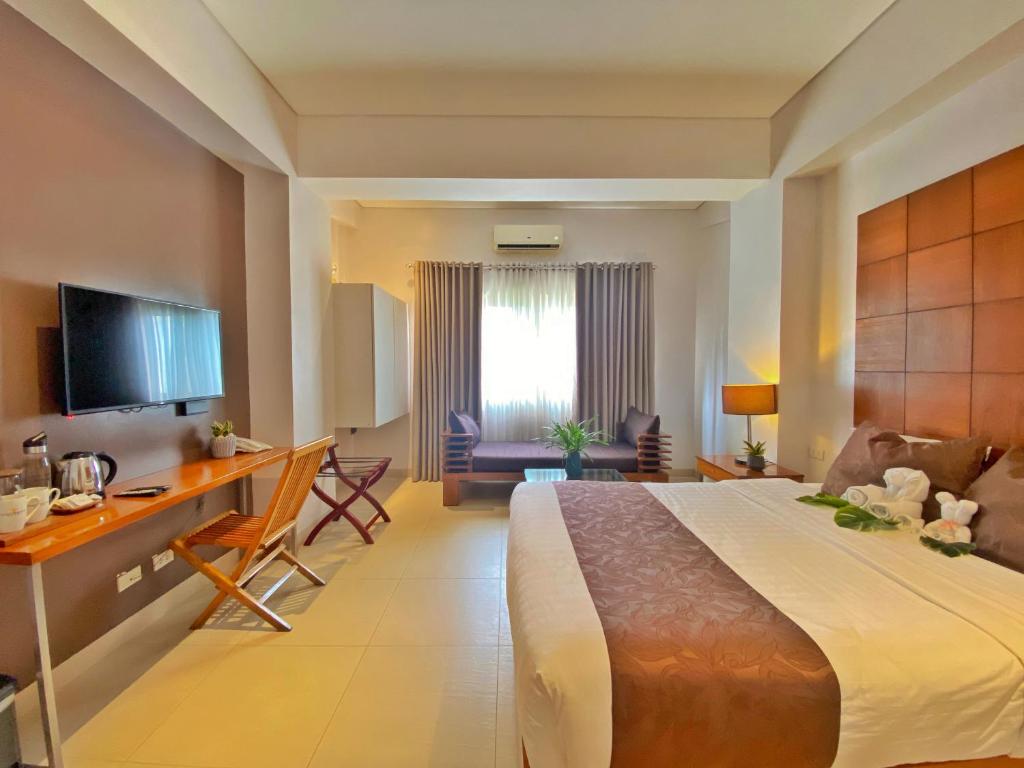 Postel nebo postele na pokoji v ubytování Aloha Boracay Hotel