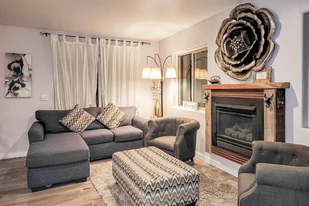 a living room with a couch and a fireplace at Adi Geda Mountain Retreat in Silverthorne