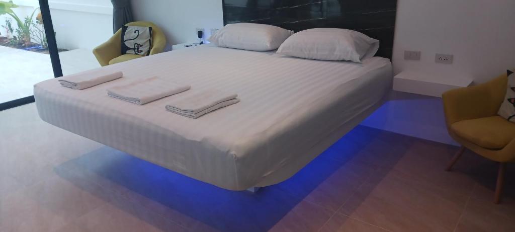 Postel nebo postele na pokoji v ubytování Kadena Villa