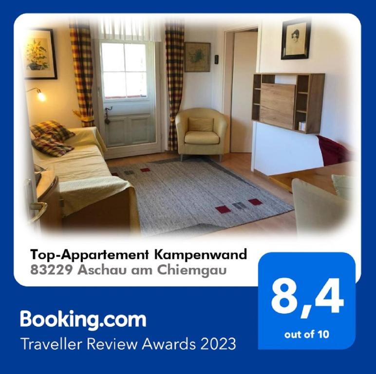 a hotel room with a bed and a living room at Top-Appartement direkt an der Kampenwandbahn in Aschau im Chiemgau