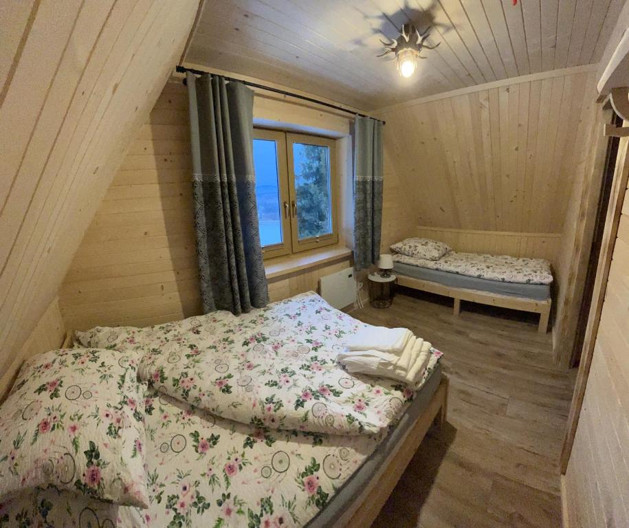 Posteľ alebo postele v izbe v ubytovaní Domek na Zrąbku Pod Gubałówką