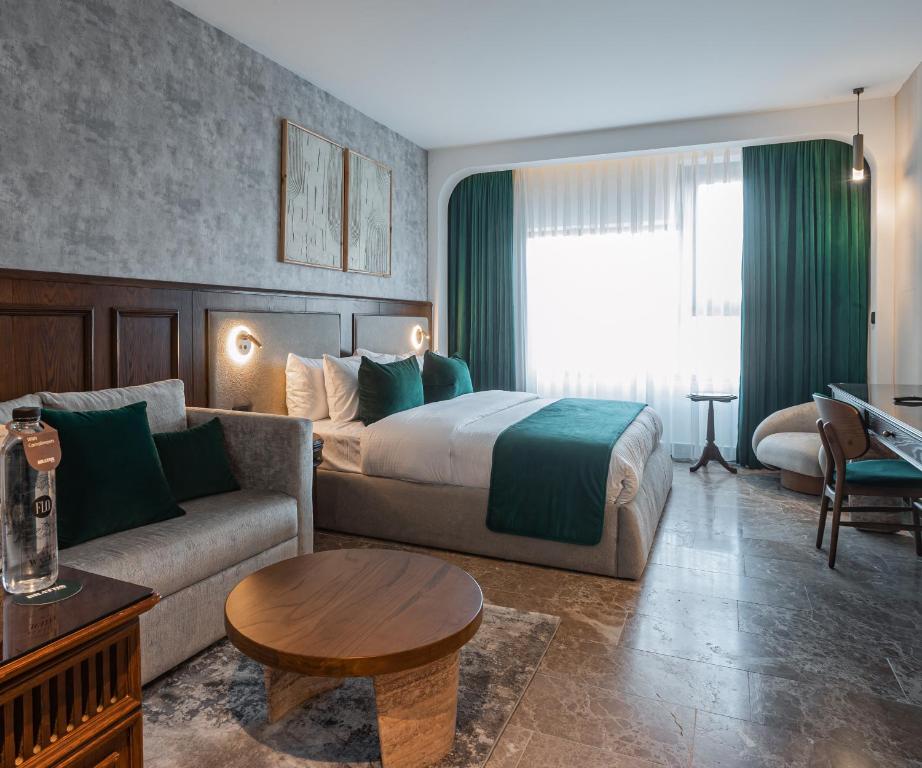 Postel nebo postele na pokoji v ubytování Bratus Hotel