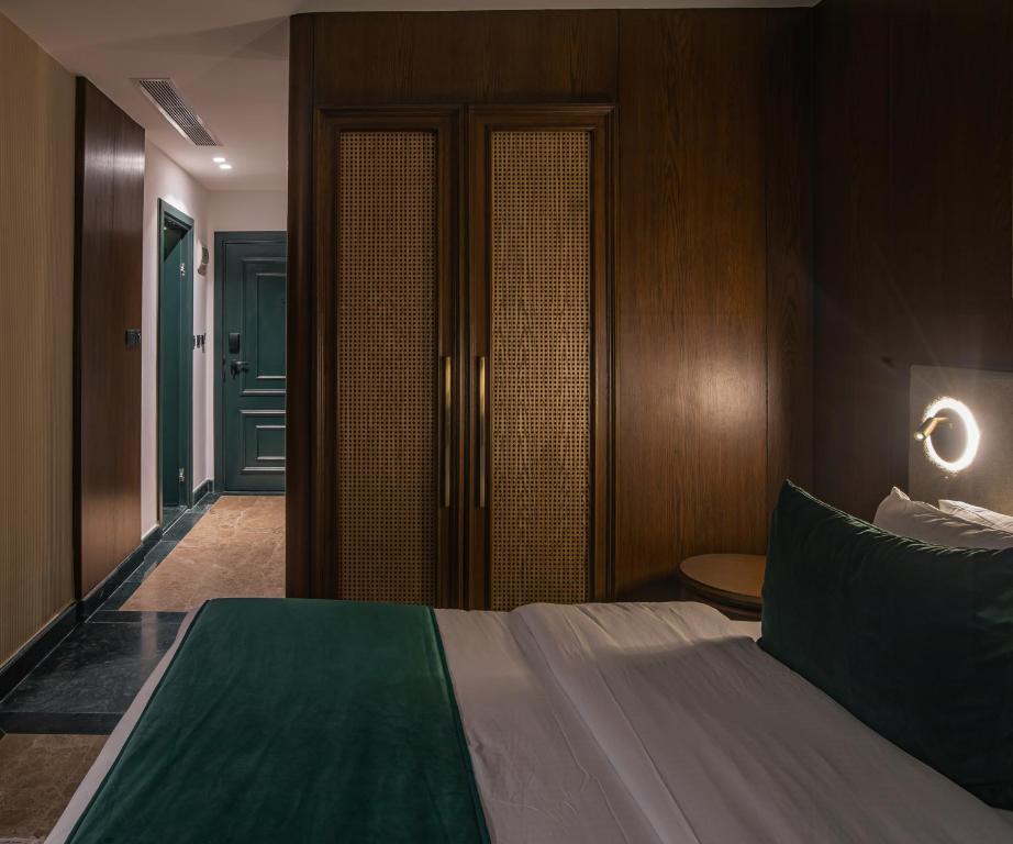 Postel nebo postele na pokoji v ubytování Bratus Hotel