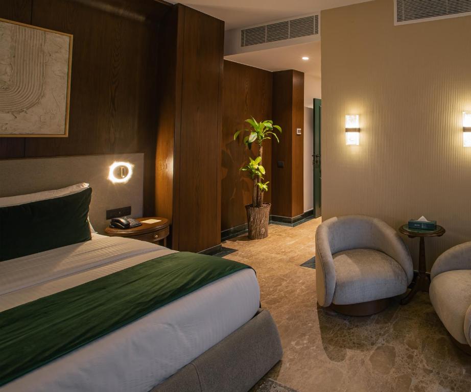Postel nebo postele na pokoji v ubytování Bratus Hotel