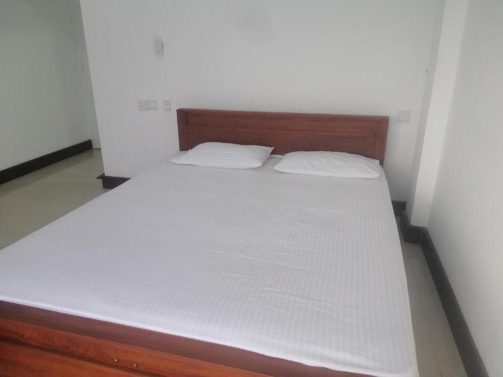 Postel nebo postele na pokoji v ubytování Glenview hotel & homestay