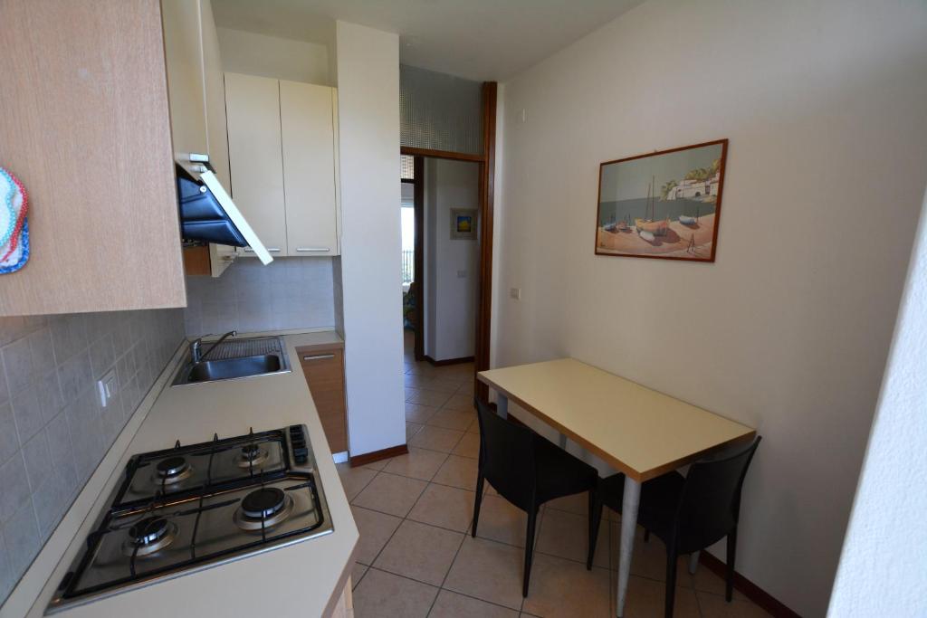 A kitchen or kitchenette at Lignano Pineta with marvellous sea view