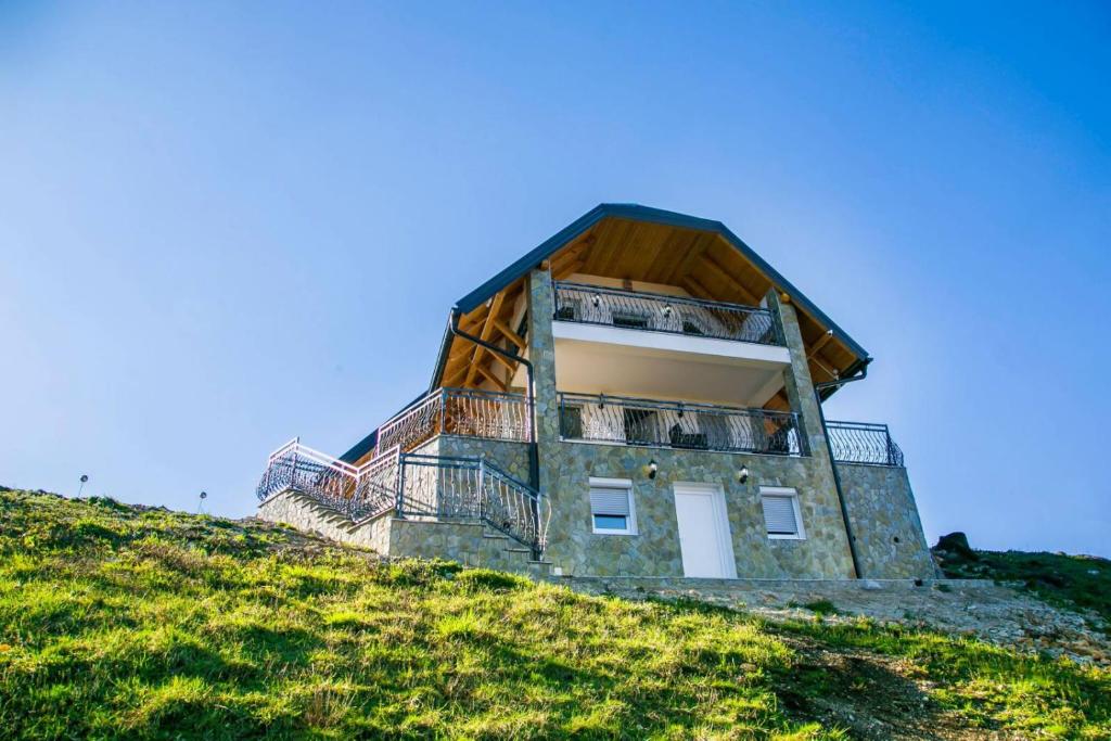 a building on top of a hill at Villa Ostrovica in Bihać