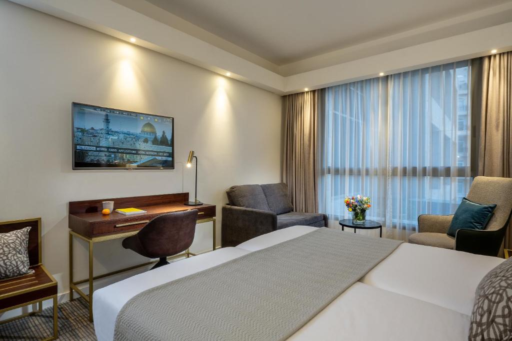 Postel nebo postele na pokoji v ubytování Olive Tree Hotel