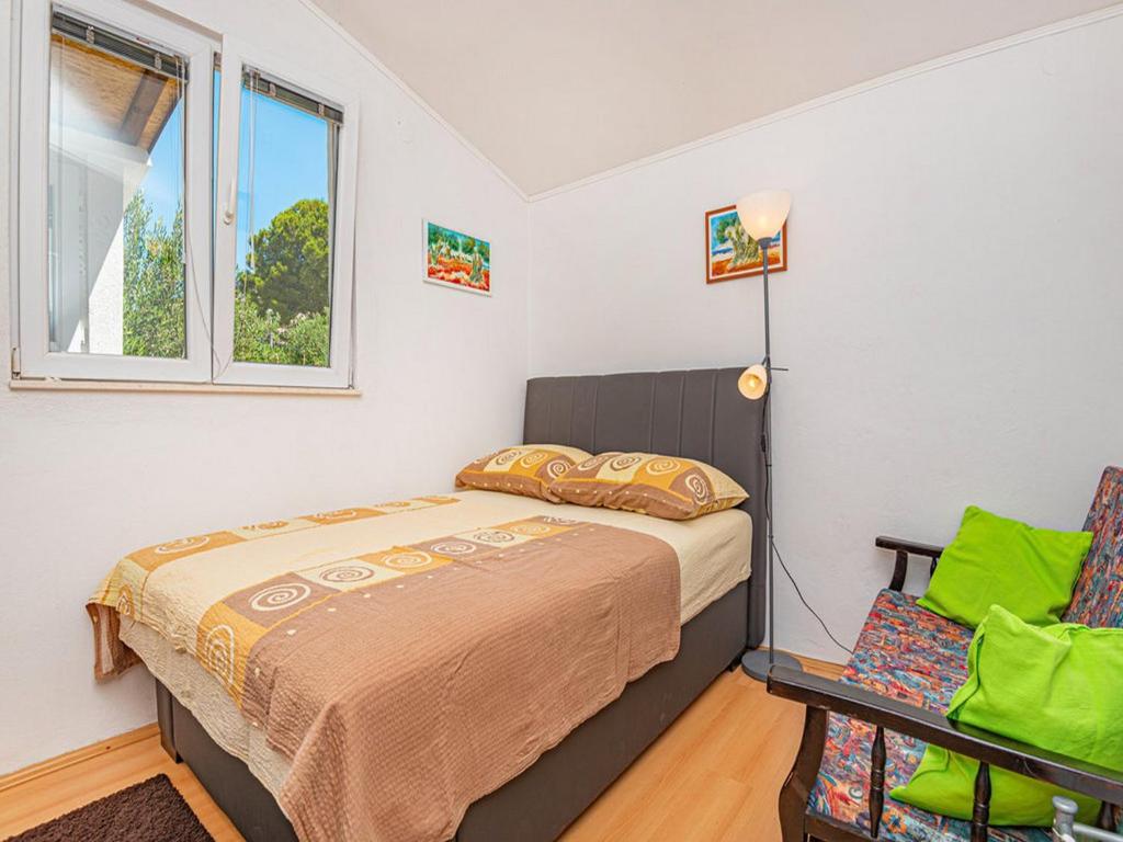 Posteľ alebo postele v izbe v ubytovaní Holiday Home Happy Holiday