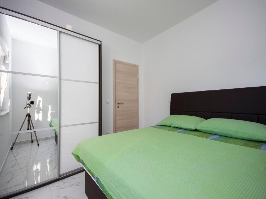 Posteľ alebo postele v izbe v ubytovaní Apartments Happy Holiday