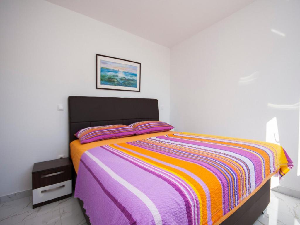 Posteľ alebo postele v izbe v ubytovaní Apartments Happy Holiday