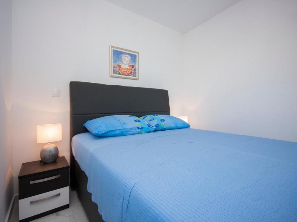 Posteľ alebo postele v izbe v ubytovaní Apartments Happy Holiday
