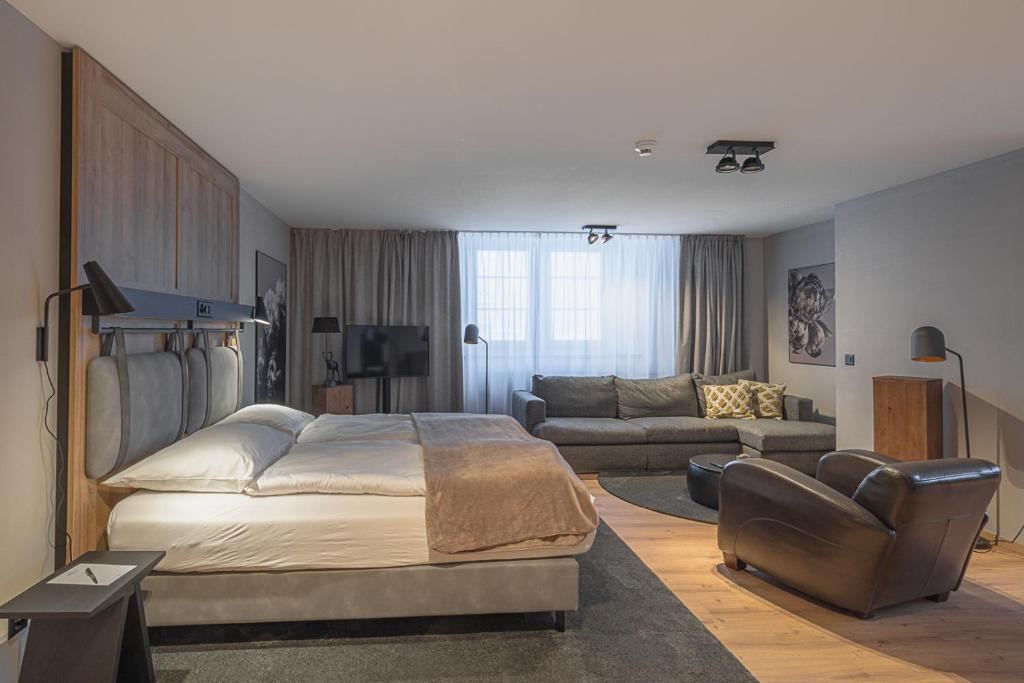 Ein Bett oder Betten in einem Zimmer der Unterkunft ALPINE INN Davos