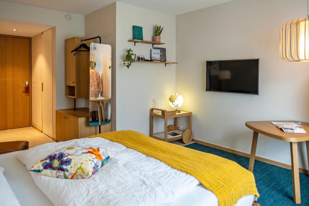 Postel nebo postele na pokoji v ubytování Nomad Design & Lifestyle Hotel