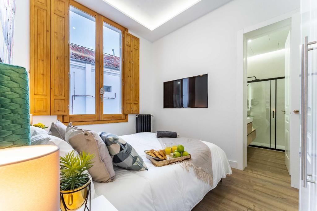 TV a/nebo společenská místnost v ubytování Exclusive Luxury Apartment in Central Madrid