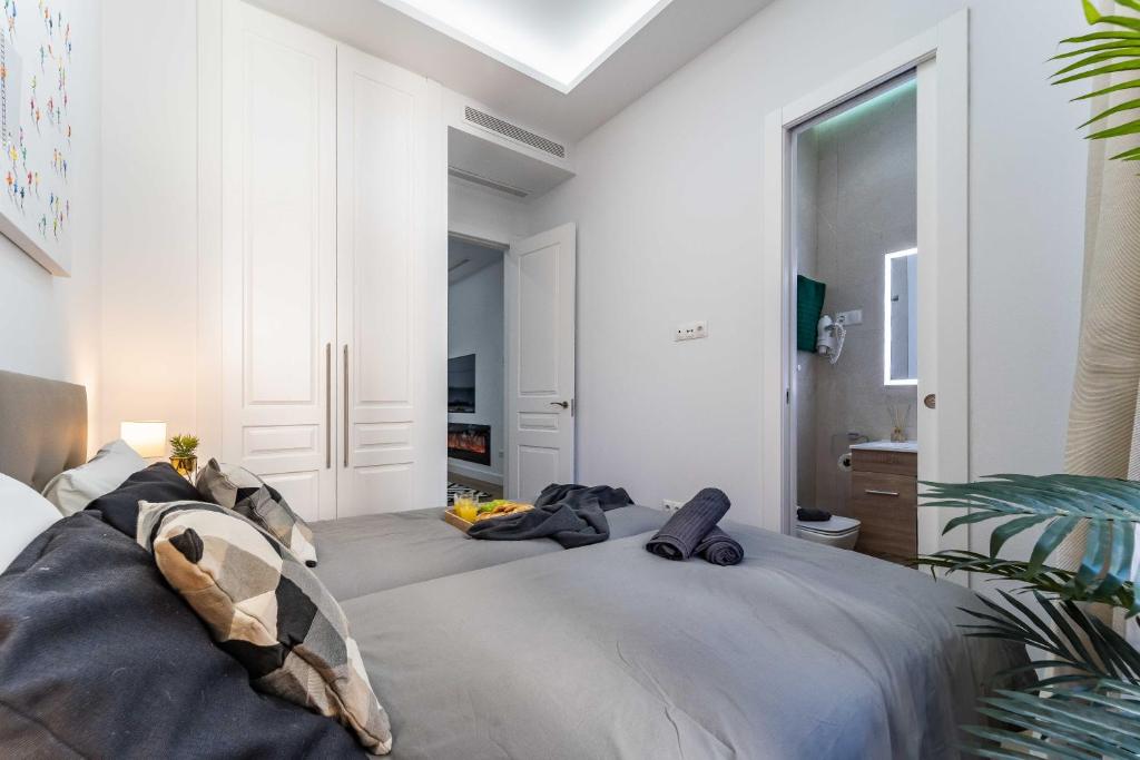 Postel nebo postele na pokoji v ubytování Exclusive Luxury Apartment in Central Madrid